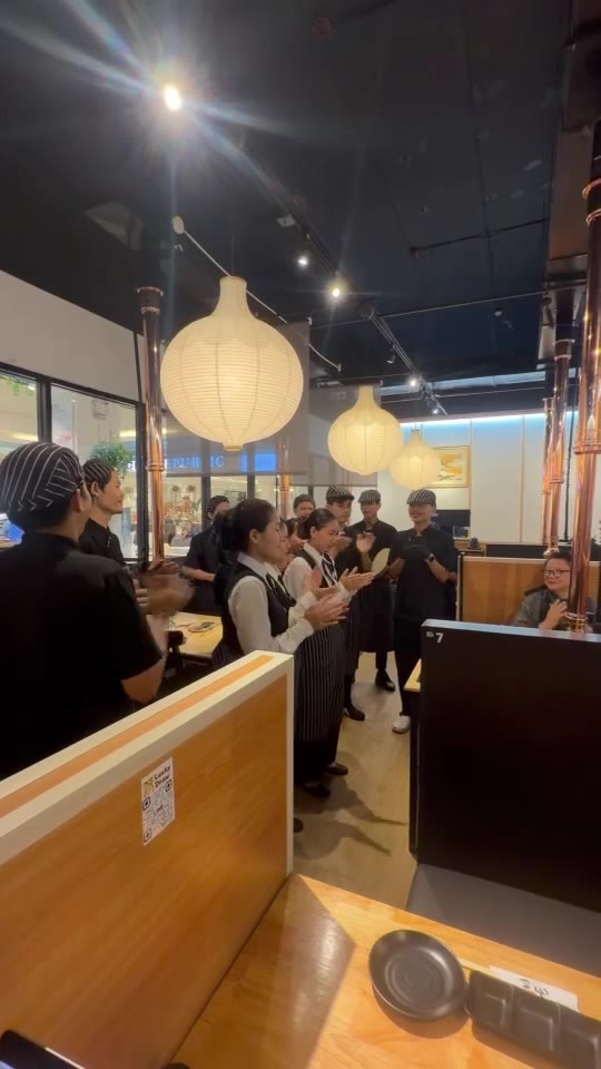 Staff singing at the table